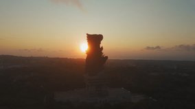 Aerial view of GWK with city lights and faint ocean glow on the horizon in Bali. A smooth forward drift reveals plaza and terraces, useful for travel content, documentary use and premium storytelling - Powered by Shutterstock - Get 15% off with code: PIKWIZARD15