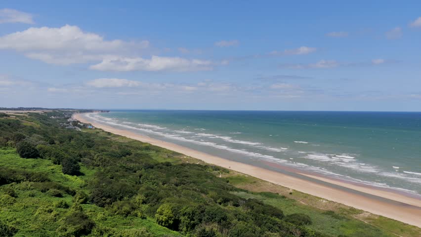 Aerial view of Omaha Beach - D-Day Landing site for World War 2 in Normandy France - American War Memorial and Cemetery	