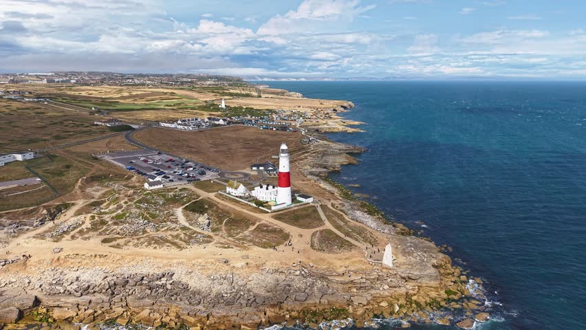 Scenic coastal landscape with the iconic Portland Bill Lighthouse, Dorset, UK.