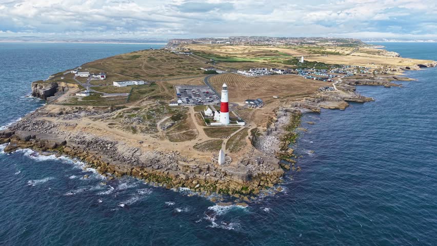 The famous Portland Bill lighthouse and rocky coastline of the Isle of Portland, UK.