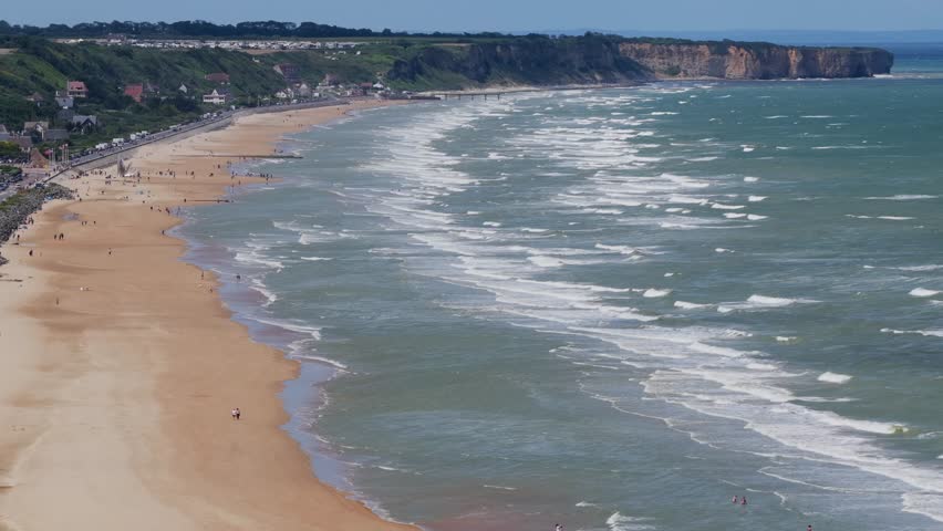 Aerial view of Omaha Beach - D-Day Landing site for World War 2 in Normandy France - American War Memorial and Cemetery	