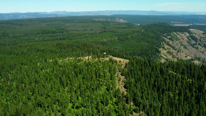 US, Oregon, Elgin, 2025-08-10 - Drone view of a fire lookout at Lookout Mountain overlooking the Grande Ronde River valley