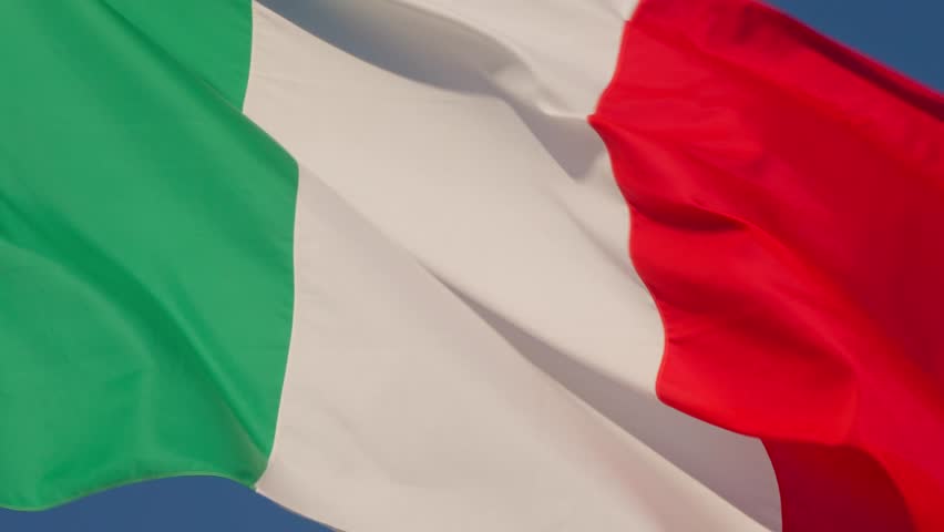 Closeup view of the Italian flag rippling in the wind under a clear sky. Captured in Rome, Italy (Roma, Italia)
