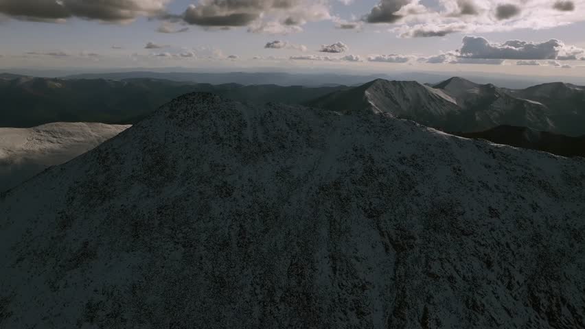 Sunset top of summit snow dusted covered Mt Mount Shavano Tabeguache Huron Peak aerial drone Colorado golden hour Rocky Mountains Mt Elbert Sawatch Range above treeline fall autumn upwards