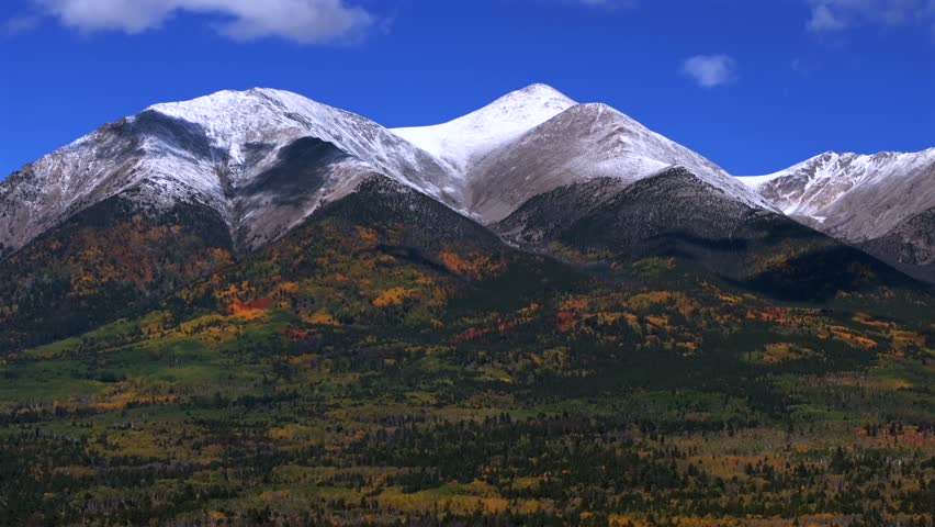 Mt Mount Shavano 14er Tabeguache Peak aerial drone Colorado trail Sawatch Range fall autumn aspen trees San Isabel National Forest snow dusting morning vibrant blue sky clouds parallax circle right
