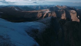 Sunset top of summit snow dusted covered Mt Mount Shavano Tabeguache Huron Peak aerial drone Colorado golden hour Rocky Mountains Mt Elbert Sawatch Range above treeline fall autumn forward pan up - Powered by Shutterstock - Get 15% off with code: PIKWIZARD15
