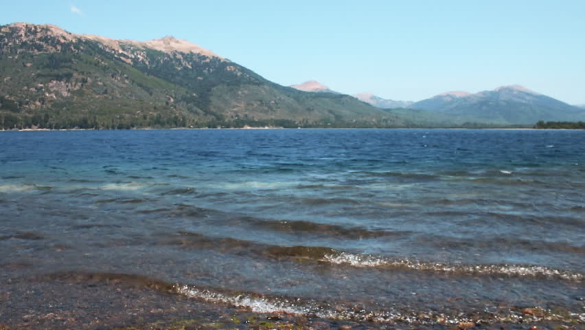 Patagonian lake shore with gentle ripples — static tripod shot, Andes, Argentina