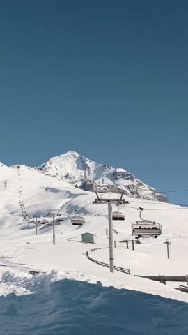 Aerial view of Tetnuldi ski resort in Svaneti region, Georgia, showcasing winter slopes, gondola lifts, and majestic Caucasus mountain scenery. Popular winter ski holiday destination eurasia