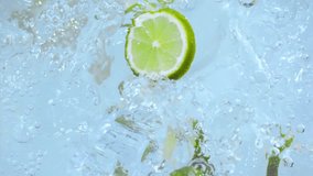 Limes, lemons, and mint leaves falling into swirling water vortex in super slow motion at 1000 fps. Fresh citrus fruits and herbs creating a refreshing splash. Perfect for drinks, cocktails, health. - Powered by Shutterstock - Get 15% off with code: PIKWIZARD15