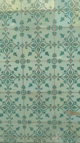 Beautifully designed tiles on the facade of a building in Lisbon, Portugal.