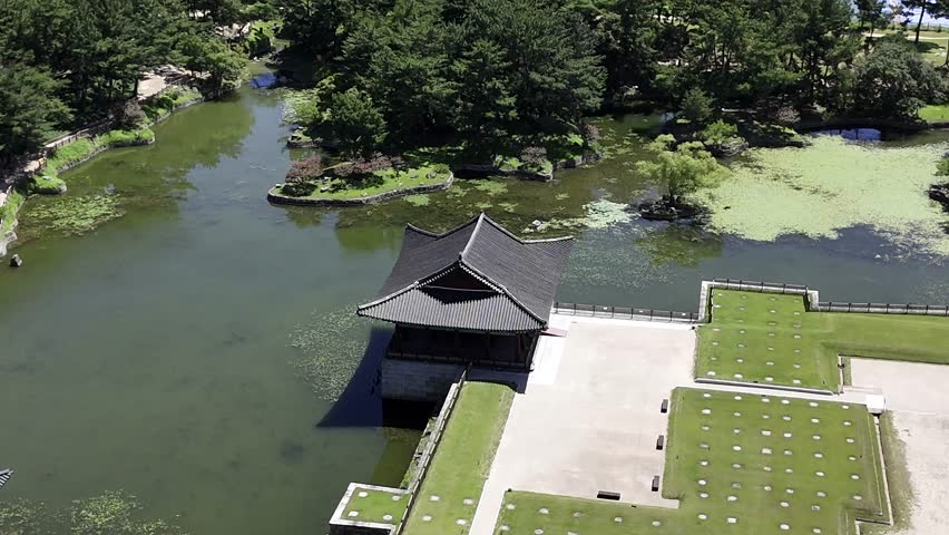 Aerial drone view of Donggung Palace and Wolji Pond at night in Gyeongju, South Korea