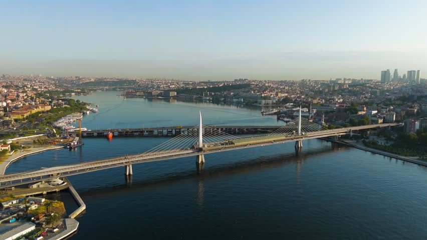 Istanbul, Turkey. Golden Horn Metro Bridge and Halic Station pedestrian crossing illuminated by morning sun over the bay, Aerial View, Point of interest