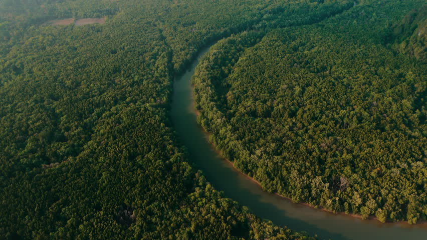Aerial drone panorama ladscape view of Phang Nga city on horizon with river, mangrove forest and mountains view