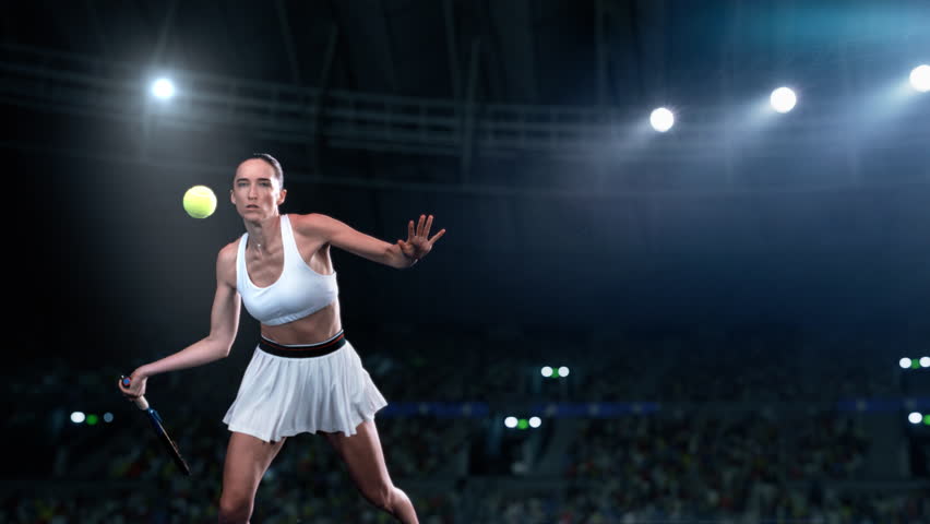 Super Slow Motion Footage of an Athletic Female Tennis Player Hitting a Ball Under Spotlights in a Dark Stadium with Spectators. Cinematic Shot Captures a Winning Strong Shot During a Match