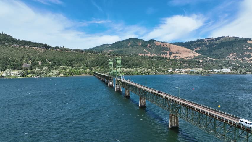 Aerial view flying around the Hood river bridge, sunny, summer day in Oregon, USA