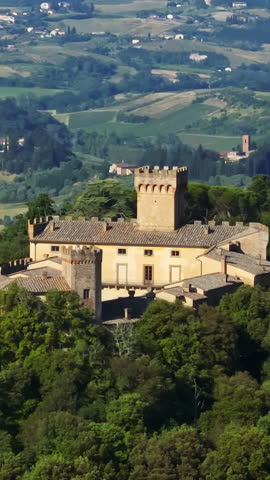 Vertical drone shot around the Castello di Santa Maria Novella, in Tuscany, Italy