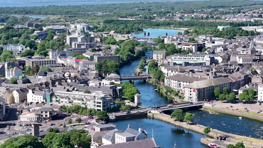 Birds eye view of Galway Cathedral and river surrounded by historical buildings. Ireland.