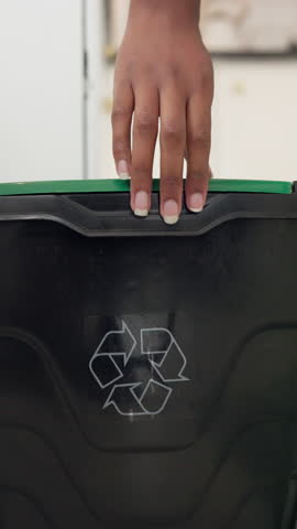 Hands, person and bottle in recycle bin to reuse material, accountability and waste management. Woman, litter and cleaning trash for sustainable disposal, plastic garbage and stop pollution at house