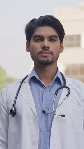 Vertical Shot of Indian Doctor Holding HIV-AIDS Poster
