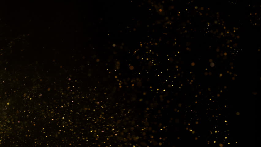 Super Slow Motion Shot of Glittering Golden Background at 1000fps.