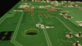 Fast dolly of a printed circuit board in a dark studio - Powered by Shutterstock - Get 15% off with code: PIKWIZARD15