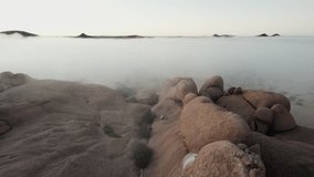 Rocky desert landscape covered in morning fog - Powered by Shutterstock - Get 15% off with code: PIKWIZARD15