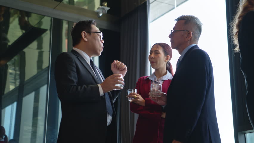 Business professionals networking and enjoying drinks at a corporate event in a modern office setting - Powered by Shutterstock - Get 15% off with code: PIKWIZARD15