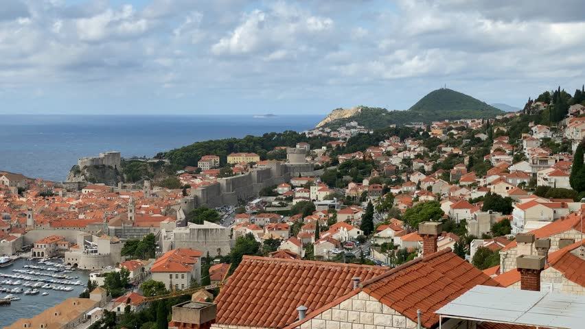 View of Dubrovniks old town with its historic walls and red-tiled rooftops seen from above video