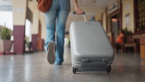 Woman traveler pulling rolling luggage at train station, symbolizing mobility, freedom, and modern travel lifestyle. - Powered by Shutterstock - Get 15% off with code: PIKWIZARD15