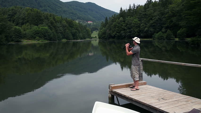 Young Man Fishing from a Stock Footage Video 100 Royalty 