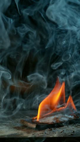 Cinematic close-up of blacksmith forging glowing hot iron on anvil with sparks flying. Shot in dramatic lighting on dark background with high-speed camera at 1000fps. Speed ramp effect.