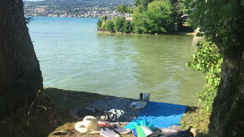 picnic crystal clear water outdoor nature weekend holiday enjoy alone blue sky sea lake slide boat people relax enjoy celebrate in Zurich Switzerland 2025 0827