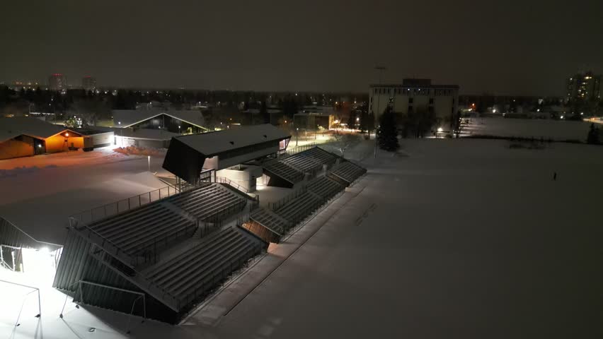 A snow-covered field on a winter evening in Canada