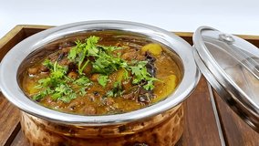 Vegetarian Legume Dish Garnished with Fresh Herb, Hearty Indian Curry Served in Silver Pot, Rustic Meal on Wooden Tray, Spiced Lentil Delight along Cilantro Topper, Home Cooked Food Feature Rich Gravy - Powered by Shutterstock - Get 15% off with code: PIKWIZARD15