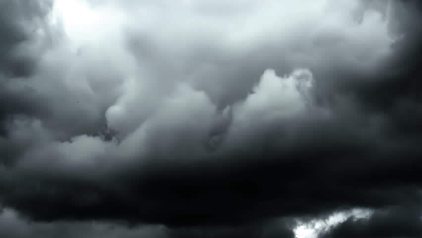4K time lapse video of grey rainy clouds in film noir style. Grey stormy sky before rain. Vintage cinematic style, drama, thriller, horror. Black and white video in film noir style.