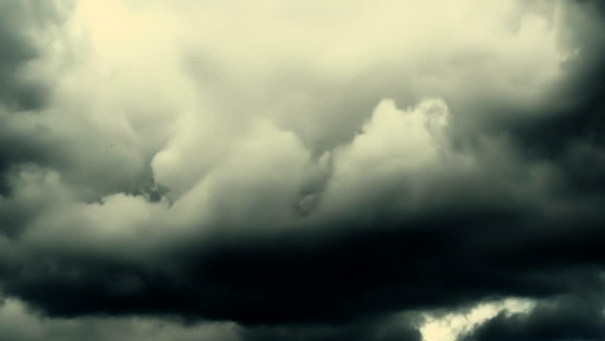 4K time lapse video of grey rainy clouds in film noir style. Grey stormy sky before rain. Vintage cinematic style, drama, thriller, horror. Black and white video in film noir style.