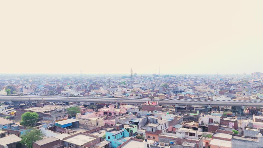Aerial View Crowded Suburb with Expressway Bridge, Drone Shot Raised Roadway Near Bustling Town Hub, Motorway Spanning Active Suburban District, Freeway offer easy commute to travelers, Infrastructure