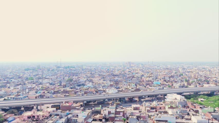 Drone Shot Raised Roadway Near Bustling Town Hub, Aerial View Crowded Suburb with Expressway Bridge, Motorway Spanning Active Suburban District, Freeway offer easy commute to travelers, Infrastructure
