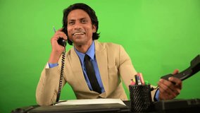 Business Executive Smiles as Juggling Two Phone Calls, Multitasking Professional Handles Workload with Ease, Office Officer Stay Focused Amid Paperwork and Landlines, Male engrossed in Multiple Work - Powered by Shutterstock - Get 15% off with code: PIKWIZARD15