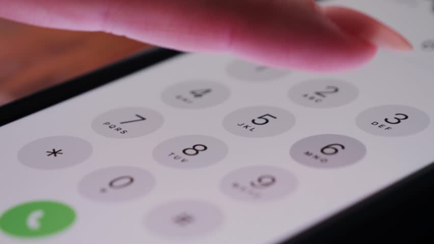 Close up of finger dialing pin or phone number on screen smartphone.