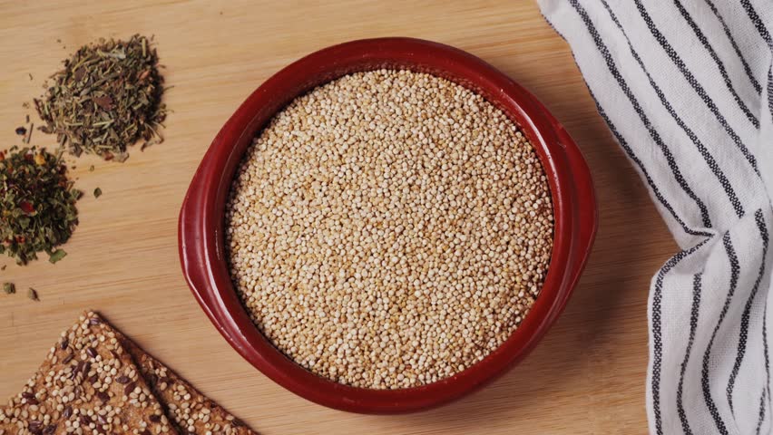 White quinoa, close-up. Quinoa seeds are rich in protein, vitamins and minerals. Healthy nutrition, vegan food.