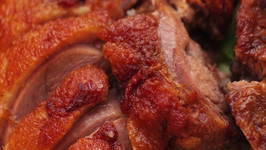Traditional crispy peking duck with steamed pancakes, onion, lettuce and hoisin sauce, tasty asian dish.