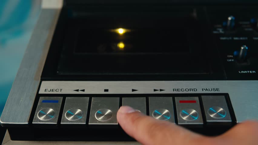 Retro radio tape recorder, audio cassette close-up. Listening to music, old radio boom box player, macro of vintage music listening. 