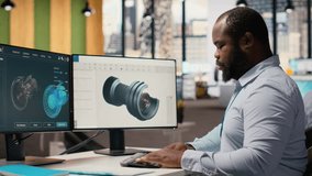 Engineer in office working on wind turbine component CAD design, doing eco friendly energy research. Employee doing digital modeling of wind energy generator part using PC program, camera B - Powered by Shutterstock - Get 15% off with code: PIKWIZARD15