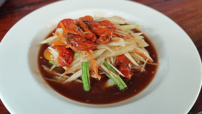 Delicious papaya salad on the background