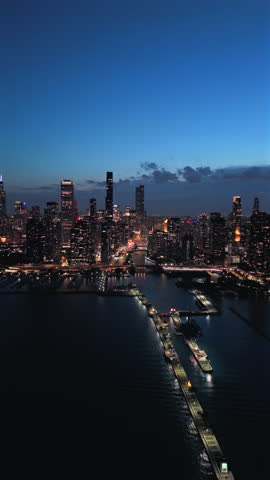 Breathtaking aerial night views of Chicago stunning skyline at night, where the lights reflect off the lake. This experience is perfect for travel enthusiasts and city lovers alike