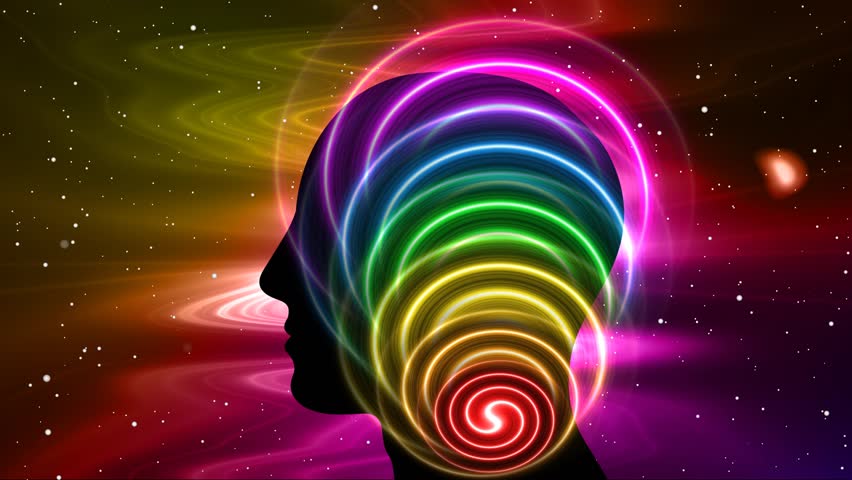 Human head silhouette with chakra light effect