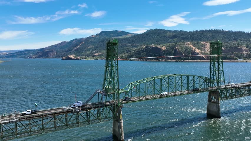 Drone circling traffic on the Hood river bridge, sunny day in Oregon, USA
