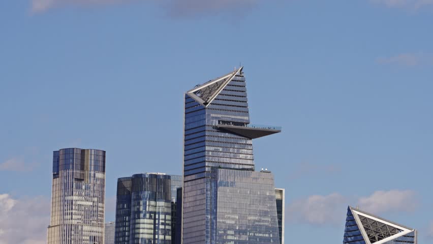 Close-up of the Edge observation deck at Hudson Yards, one of New York City’s tallest skyscrapers, under a clear blue sky.