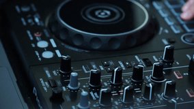 DJ playing music outdoors, man with headphones at DJ console, street performance with DJ equipment, outdoor party with disc jockey, music event in open air, DJ mixing tracks outside, - Powered by Shutterstock - Get 15% off with code: PIKWIZARD15